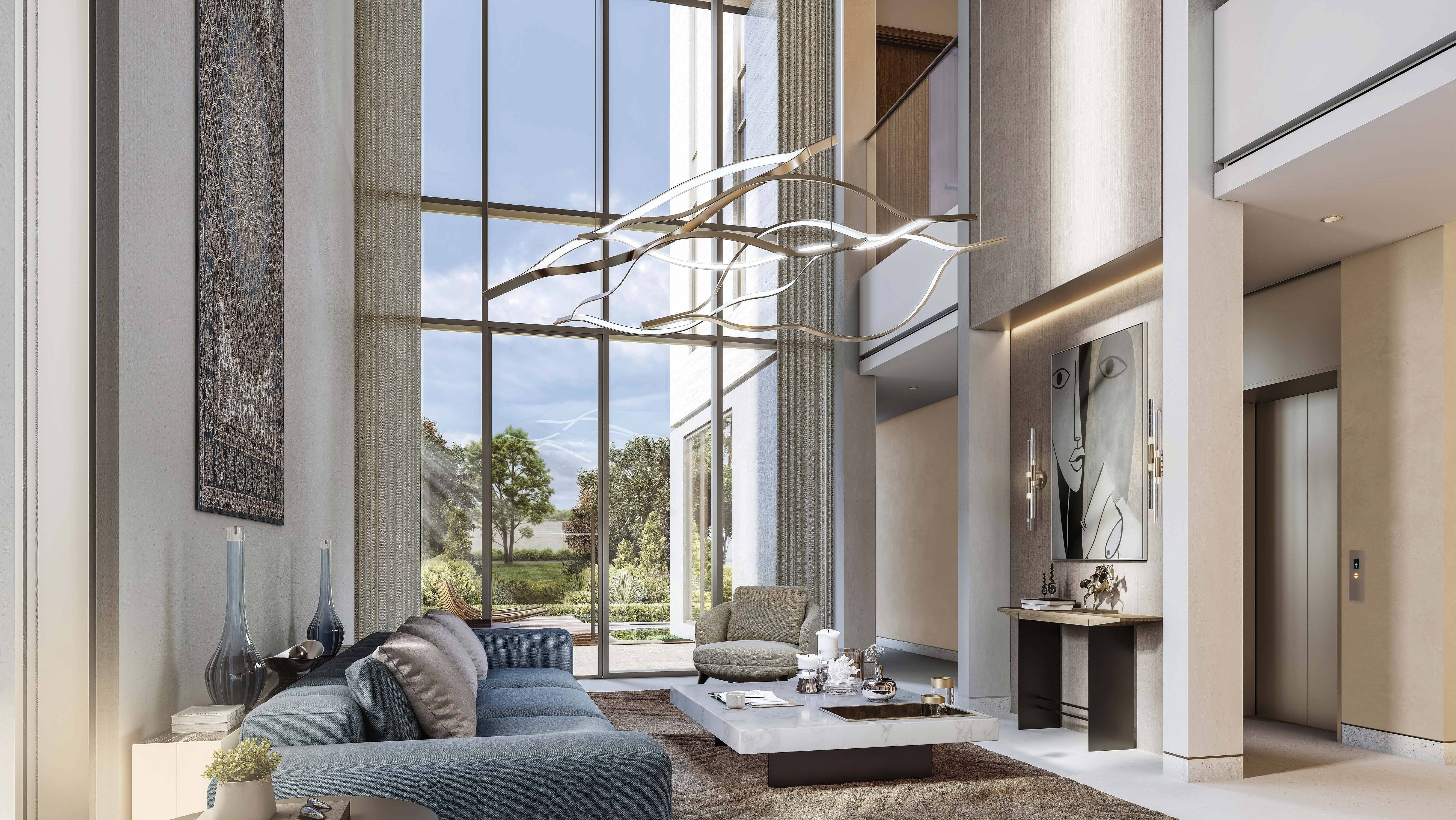 Spacious living room at The Orchard Sobha City featuring modern interiors, large windows, and seamless indoor‑outdoor luxury living.