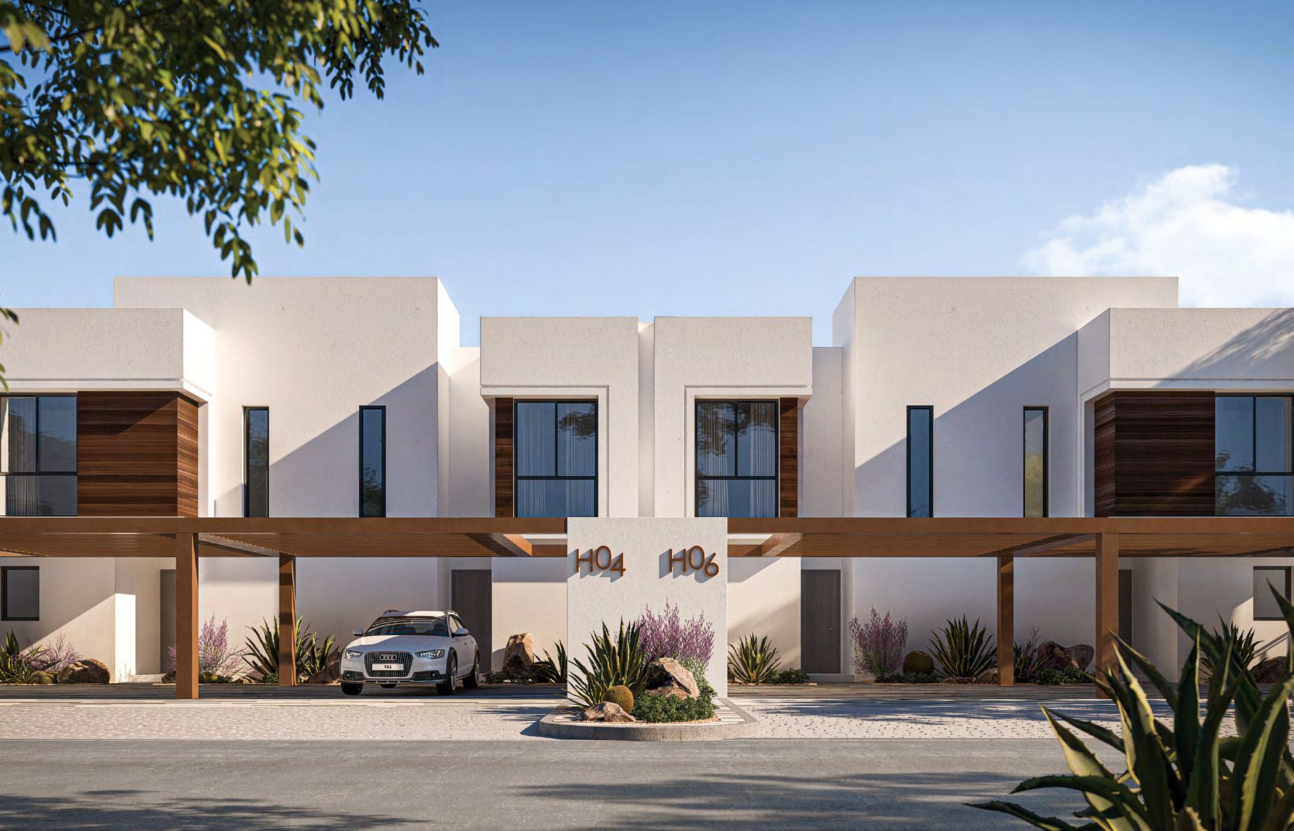 Noya Yas Island villa nighttime exterior with warm lighting, serene setting on Yas Island